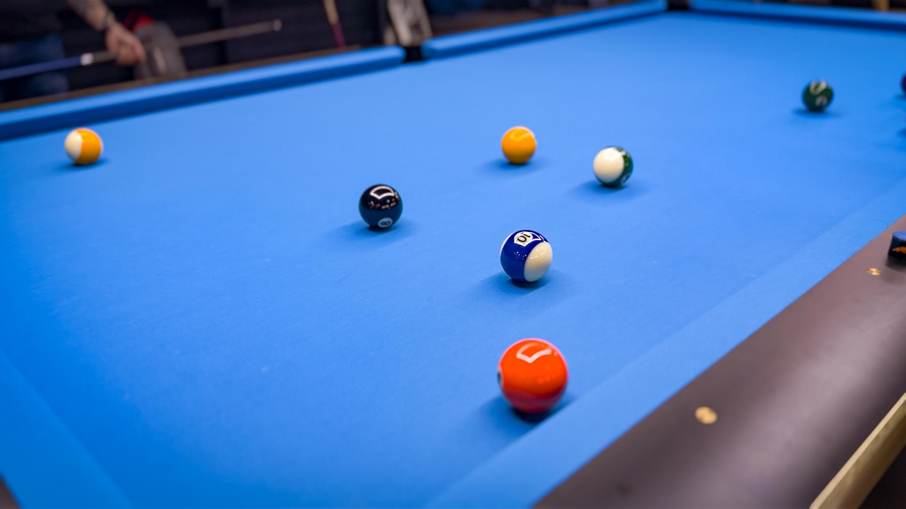 Close up of billiards cue on table